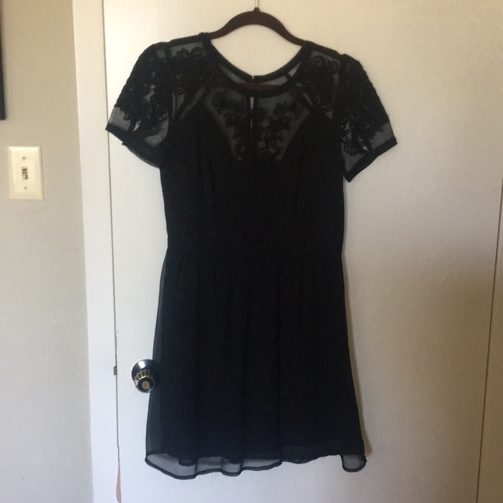 Black dress with lace appliqué
